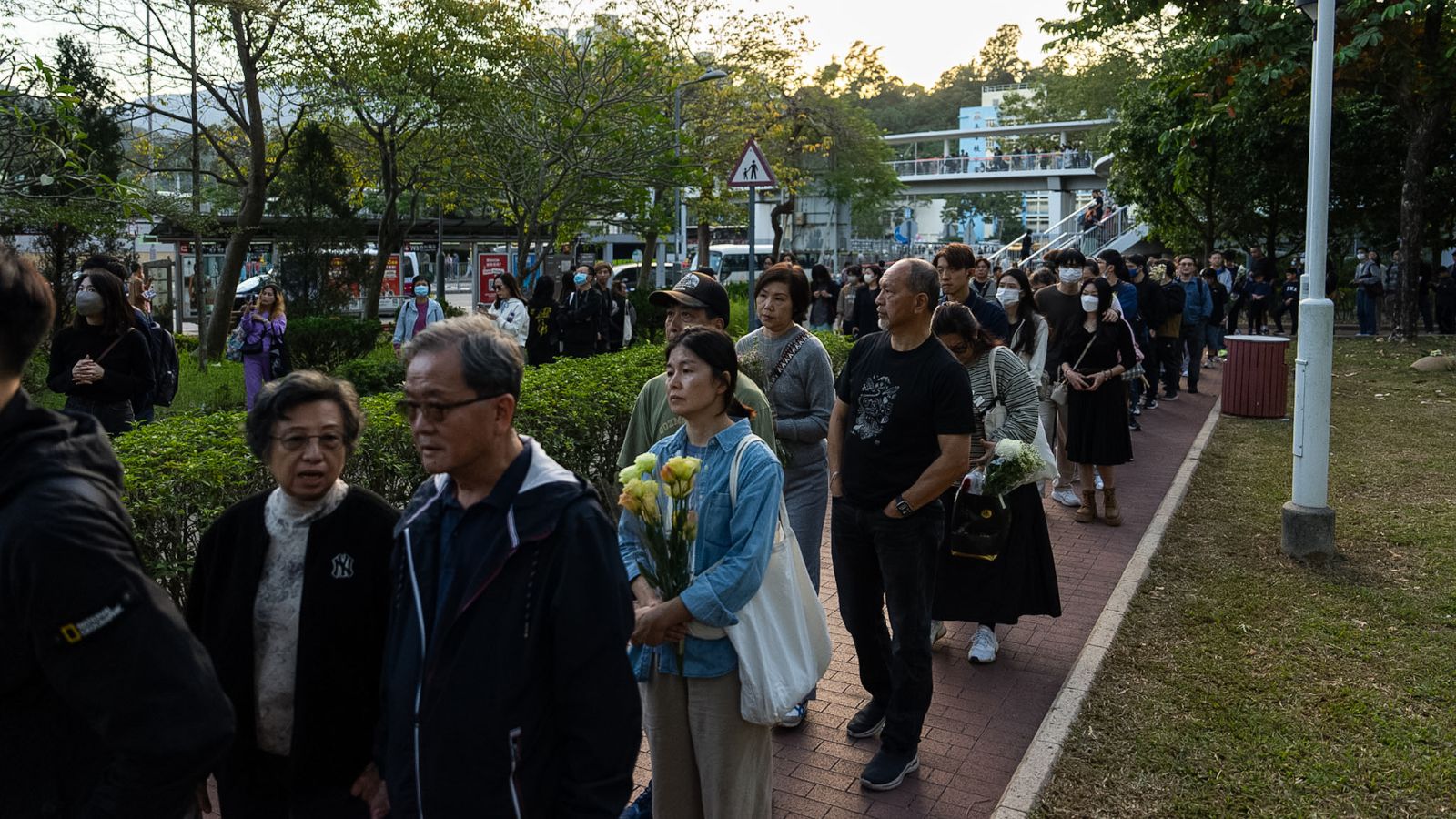 Hong Kong mourns victims of blaze that killed 128 and counting