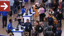 Travelers wait at a security checkpoint at Seattle-Tacoma International Airport, Thursday, Nov. 6, 2025, in SeaTac, Wash. (AP Photo/Lindsey Wasson)