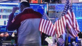 Trader Anan Patel works on the floor of the New York Stock Exchange, Tuesday, Nov. 18, 2025. (AP Photo/Richard Drew)