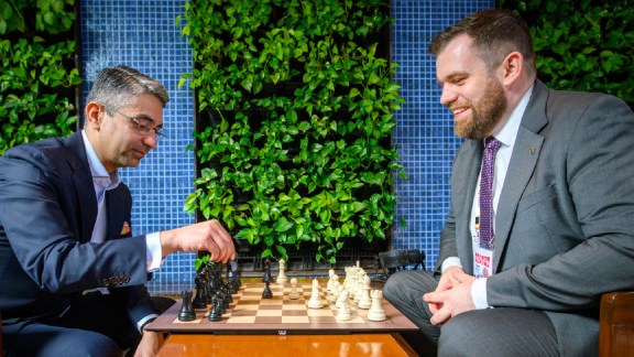 India's first individual Olympic medallist Abhinav Bindra sits across a chess board from FIDE Secretary General Lukasz Turlej after making the ceremonial first move at the FIDE World Cup final. (PHOTO: Michal Walusza via FIDE)