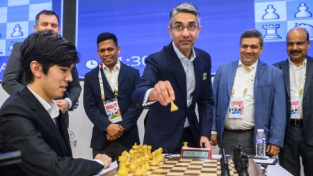 India’s first individual gold medallist, Abhinav Bindra, makes the ceremonial first move in the FIDE World Cup final in Goa. (PHOTO: Michal Walusza)