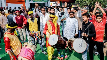 Party supporters celebrate the party's lead in Bihar assembly elections on Friday