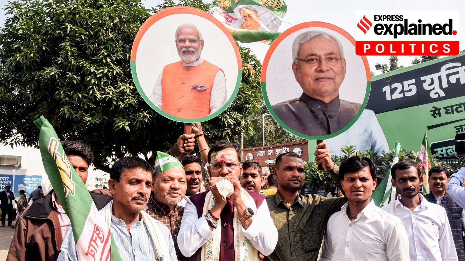 Bihar elections 2025 results: Janata Dal (United) (JD-U) supporters hold placards of Prime Minister Narendra Modi and Bihar Chief Minister Nitish Kumar as they celebrate NDA's lead in the vote counting of the Bihar Assembly election 2025 at the party office, in Patna on Friday.