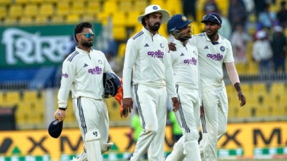 India players leave the ground at the end of the a day in the second cricket Test match between India and South Africa in Guwahati. (AP Photo)