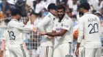 India's Kuldeep Yadav congratulates Jasprit Bumrah after the pacer took a South African wicket on Day 1 of the Kolkata Test at Eden Gardens. (Express Photo by Partha Paul)