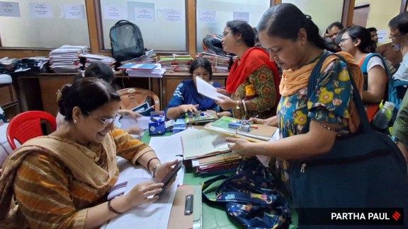 Enumeration forms and other materials for SIR being distributed to BLOs at the Jessop Building, Kolkata