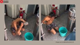 Man takes bath inside moving train in Jhansi