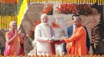 Prime Minister Narendra Modi and Uttar Pradesh Chief Minister Yogi Adityanath attending flag hoisting ceremoney of Ram Janambhoomi Temple in Ayodya on tuesday. Express Photo Vishal Srivastava