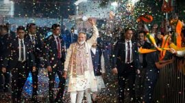 modi bihar New Delhi: Prime Minister Narendra Modi waves a ‘gamcha’ as he arrives during the celebration of NDA’s victory in the Bihar Assembly elections, at BJP headquarters, in New Delhi, Friday, Nov. 14, 2025. Union Health Minister and BJP National President JP Nadda is also seen. (PTI Photo/Ravi Choudhary) (PTI11_14_2025_000411A)
