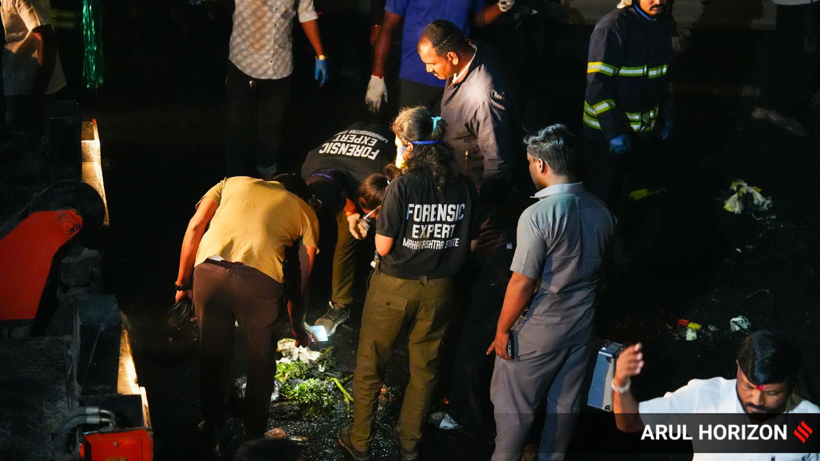 Forensic experts at the spot where a major accident took place on the Navale Bridge area of the Katraj–Dehu Road Bypass along the Pune–Bangalore Highway on Thursday evening. (Express Photo by Arul Horizon)