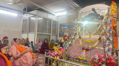 Gurudwara Dashmesh Darbar is a humble structure with corrugated tin roof held up by metal pillars.