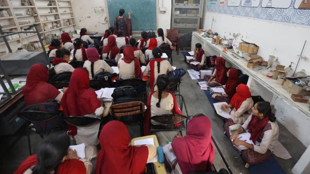 At govt senior secondary for girls, Malerkotla, students sit on ground and chemistry lab is converted into a classroom due to lack of space. (Express photo: Gurmeet Singh)