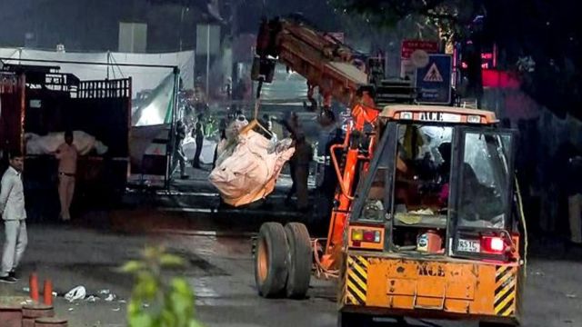 Debris being removed from the car blast site near the Red Fort, in Delhi. (Source: ANI)