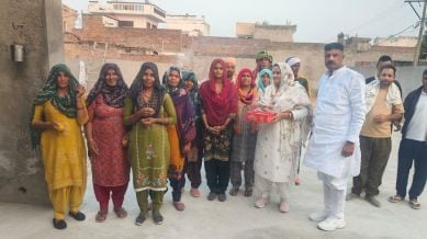 Village sarpanch Urmila with Justice Surya Kant at Haryana Bhawan in New Delhi. Photo special arrangement