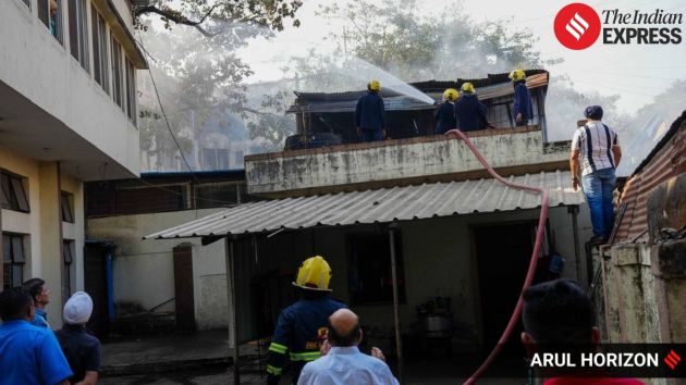 Fire brigade personnel respond to a fire at a motor vehicle workshop on JM Road in Pune on Friday