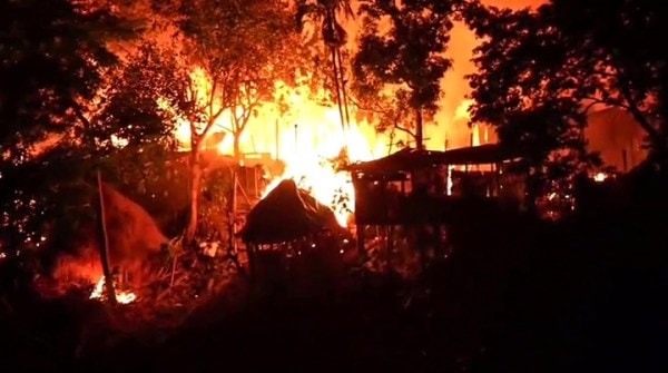 Flames billow out from an area following violent protests over the demand for evictions of illegal encroachers from the Village Grazing Reserve (VGR) and Professional Grazing Reserve (PGR) lands in the hilly district, in Karbi Anglong on Tuesday. 