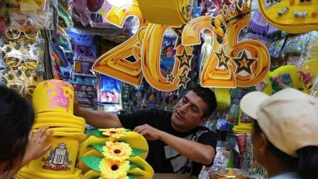 A vendor sells New Year's eve party goods at a market in downtown Lima, Peru