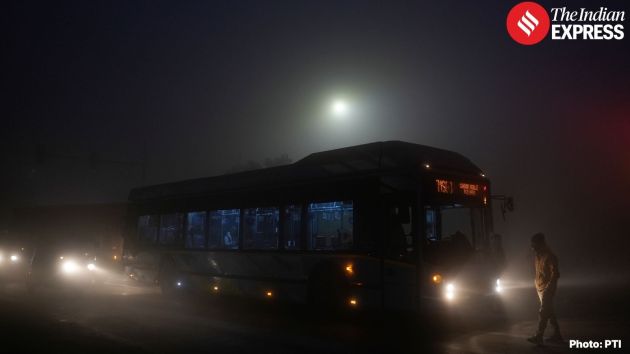 Traffic flow continued under reduced visibility conditions as vehicles navigated through fog-laden roads