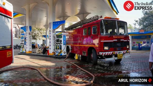 Emergency crews focused on containing the blaze due to the proximity of a fuel station