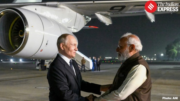 Prime Minister Narendra Modi greets President Vladimir Putin with a warm handshake