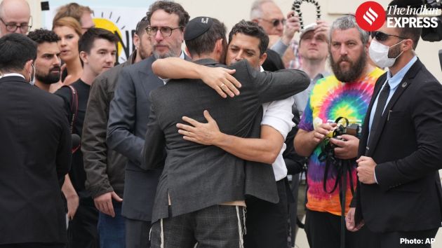 Sydney police and emergency crews stand guard near the memorial and crime scene,