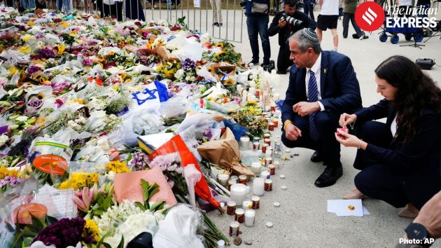 Israel’s Ambassador to Australia, Amir Maimon, pauses at the floral memorial at the Bondi Pavilion
