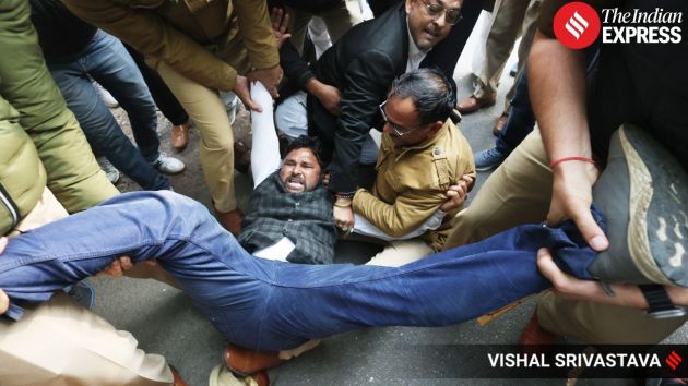 Security personnel disperse the demonstrators after detentions