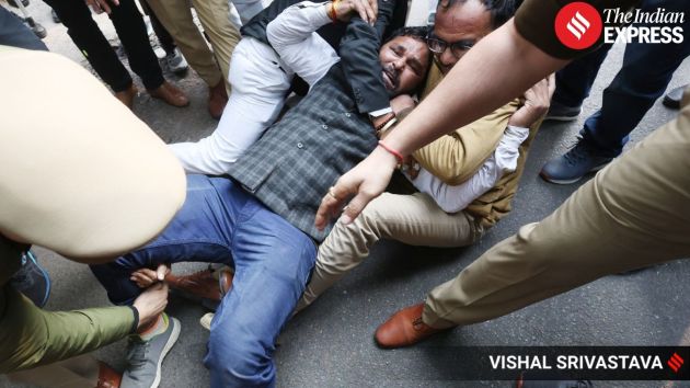 Police detain several Congress workers during the protest as tensions rise at the barricaded site