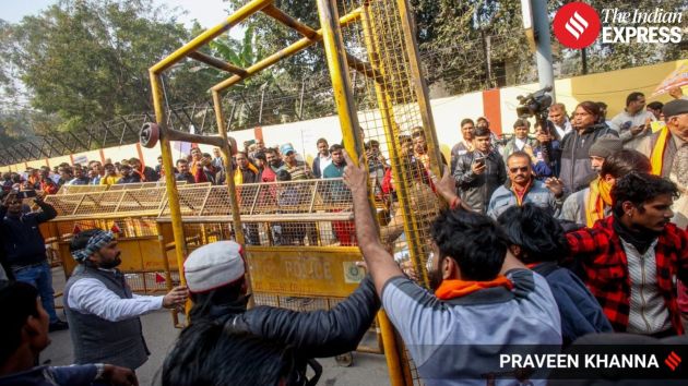 Tensions escalated as a massive crowd of demonstrators pushed against the barricades