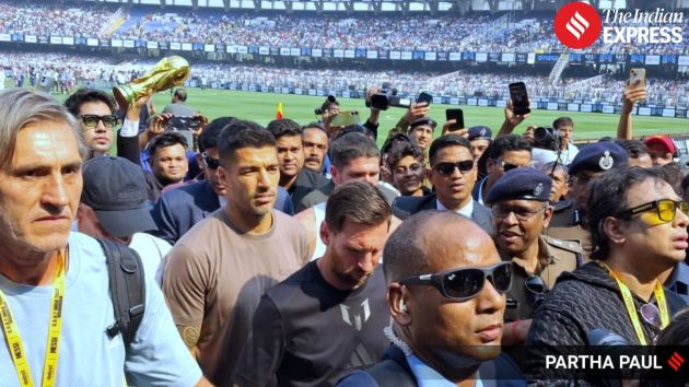 Lionel Messi is escorted out of the stadium for safety as unrest continues in parts of the venue