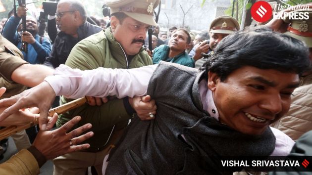 Congress workers attempt to march towards the BJP office in Lucknow but are stopped