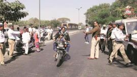 Ahmedabad traffic police, head constable, suspension, woman, traffic violations, Paldi area,