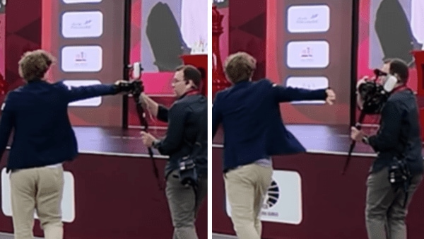 Magnus Carlsen shoves a camera after losing a game at World Rapid and Blitz Championship in Doha. (Screengrab/Instagram - ChessbaseIndia)
