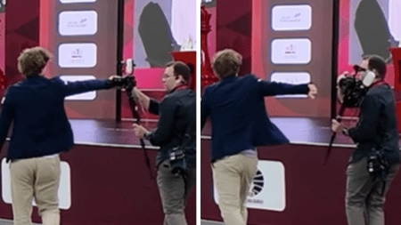 Magnus Carlsen shoves a camera after losing a game at World Rapid and Blitz Championship in Doha. (Screengrab/Instagram - ChessbaseIndia)