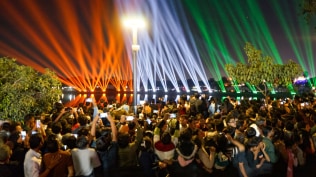 The carnival features concerts, drone and laser shows, workshops, and extensive security arrangements for lakhs of visitors.