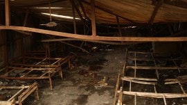 Charred remains of beds and debris at the shelter. Gajendra Yadav Bike exploded in flames, blocked victims’ way, say slum residents