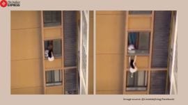 China woman clings from balcony
