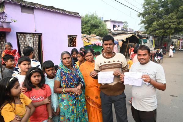 Residents show official eviction notices in Patna with regard to the Anti- Encroachment Drive.