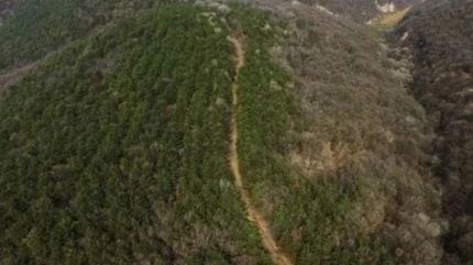 Archaeologists uncovered straight, continuous trench passes, reinforced slopes made of rammed earth, compacted roadbeds and valleys that had been deliberately filled to maintain a level route. (image: SCMP/ Handout)