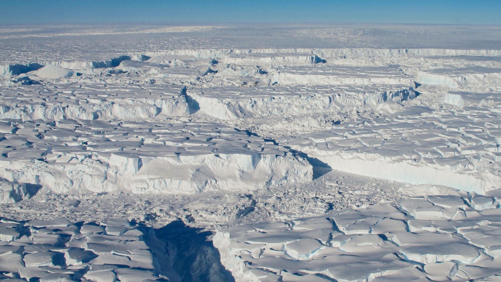 A photo provided by J. Yungel/NASA shows crevassed ice during a flight over the Thwaites ice shelf on Oct. 16, 2012. Recent research has led scientists to new conclusions about the fastest melting glacier in Antarctica. Some are reassuring, others the opposite. (Image: New York Times)