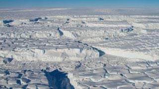 A photo provided by J. Yungel/NASA shows crevassed ice during a flight over the Thwaites ice shelf on Oct. 16, 2012. Recent research has led scientists to new conclusions about the fastest melting glacier in Antarctica. Some are reassuring, others the opposite. (Image: New York Times)