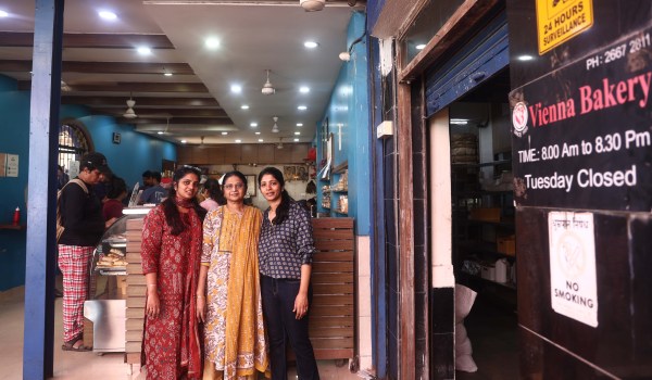 Sisters Indu Natesan and Tara Ray check on freshly baked puffs at Vienna Bakery’s production facility. (Express photo by Amit Chakravarty) 