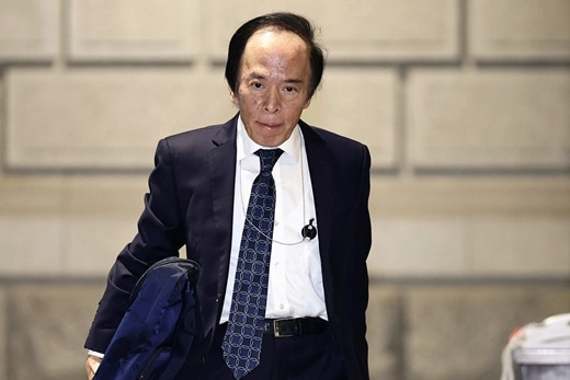 The Bank of Japan (BOJ) Gov. Kazuo Ueda arrives at the headquarters of BOJ in Tokyo, Friday, Dec. 19, 2025.