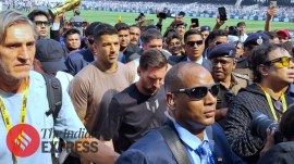 Lionel Messi and Luis Suarez are escorted by security and flanked by local politicians and VIPs during the Kolkata leg of Lionel Messi's GOAT Tour inside the Salt Lake Stadium. (Express Photo by Partha Paul)