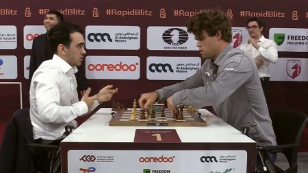 Armenian grandmaster Haik M Martirosyan protests as Magnus Carlsen resets his pieces after knocking them over in their 14th round clash at the FIDE World Blitz Championship. (PHOTO: Screengrab via FIDE YouTube)