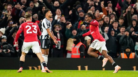 Manchester United's Patrick Dorgu, right, celebrates after scoring the opening goal during the English Premier League match vs Newcastle. (PHOTO: AP)