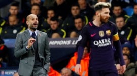 FILE | Manager Pep Guardiola and Lionel Messi. (PHOTO: Reuters)