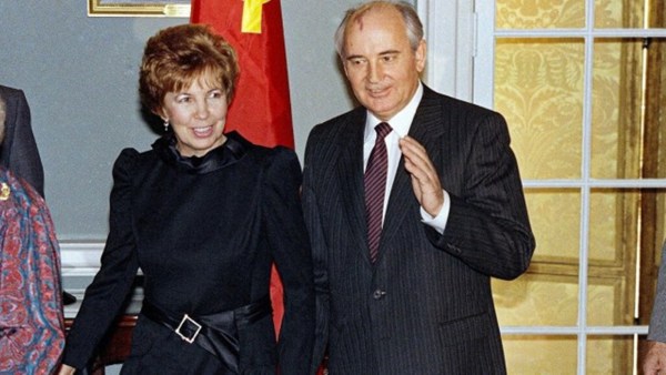 Soviet leader Mikhail Gorbachev, holds his wife Raisa's hand as they arrive at the State Department in Washington on Dec. 9, 1987 for a luncheon in their honor. (AP, file)