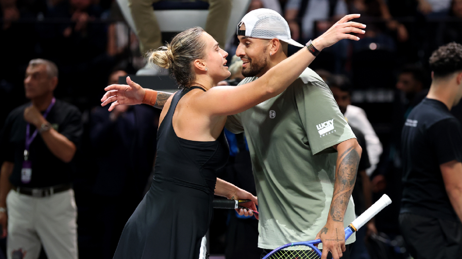 Nick Kyrgios and Aryna Sabalenka embrace at the net at the end of their Battle of the Sexes match, in Dubai, United Arab Emirates, Sunday. (AP Photo)