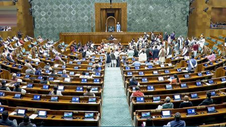 Lok Sabha Speaker Om Birla conducts proceedings in the House amid protest by opposition members in the well during the Winter Session of Parliament, in New Delhi, Tuesday, Dec. 2, 2025. (Sansad TV via PTI Photo)
